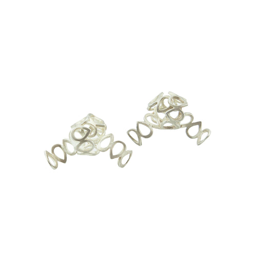  One-of-a-kind knotted lace earrings, cut out and formed by hand, in sterling silver.   Size: 30mm wide Style: Button Metal: Sterling Silver Handmade by Meg C
