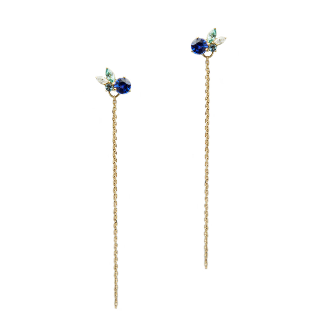 Blue Sapphire, Blue Zircon, Diamond and Aquamarine stones set in 14k yellow gold, adorned with a wraparound gold chain.  Size: 2.5
