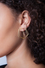 18k yellow gold pentagon cage earrings are the perfect accessory to make a modern, elegant statement. Pairs well with Meg C's Pentagon Bracelet!   Size: 1.5" h x 1.5" w Style: Button Metal: 18k Yellow Gold Handmade by Meg C