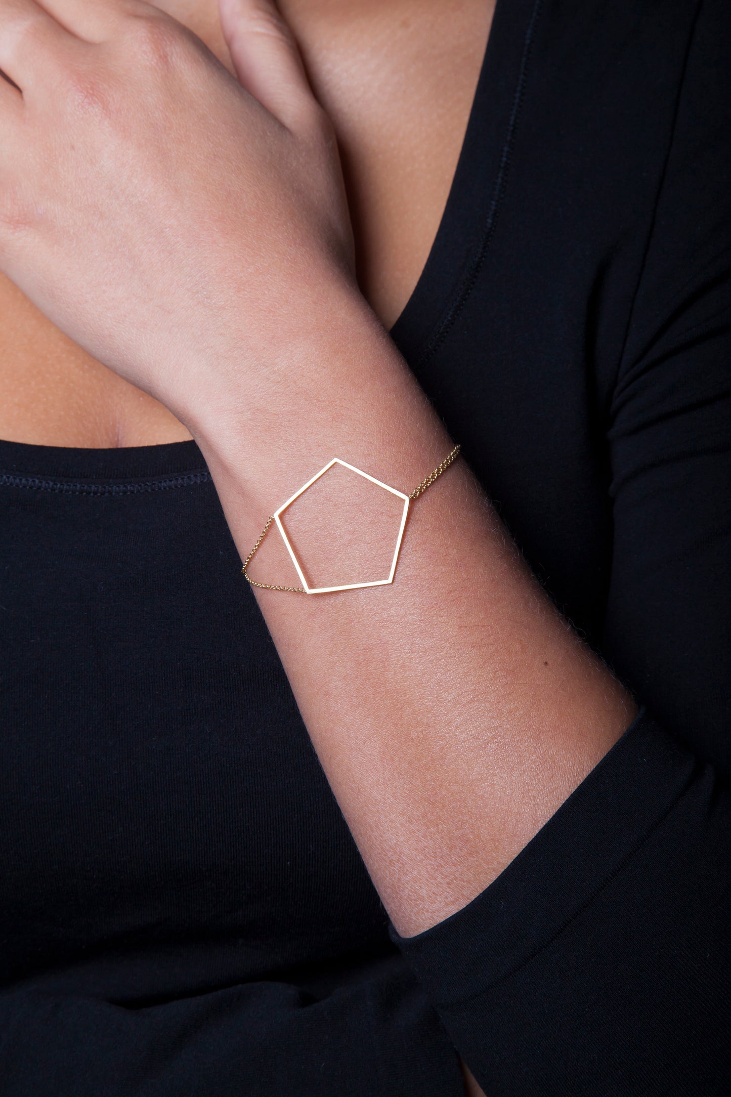 18k yellow gold pentagon bracelet on 18k yellow gold double cable chains.   Size: 7" in length; Pentagon: 1.5" wide Metal: 18k Yellow Gold Handmade by Meg C