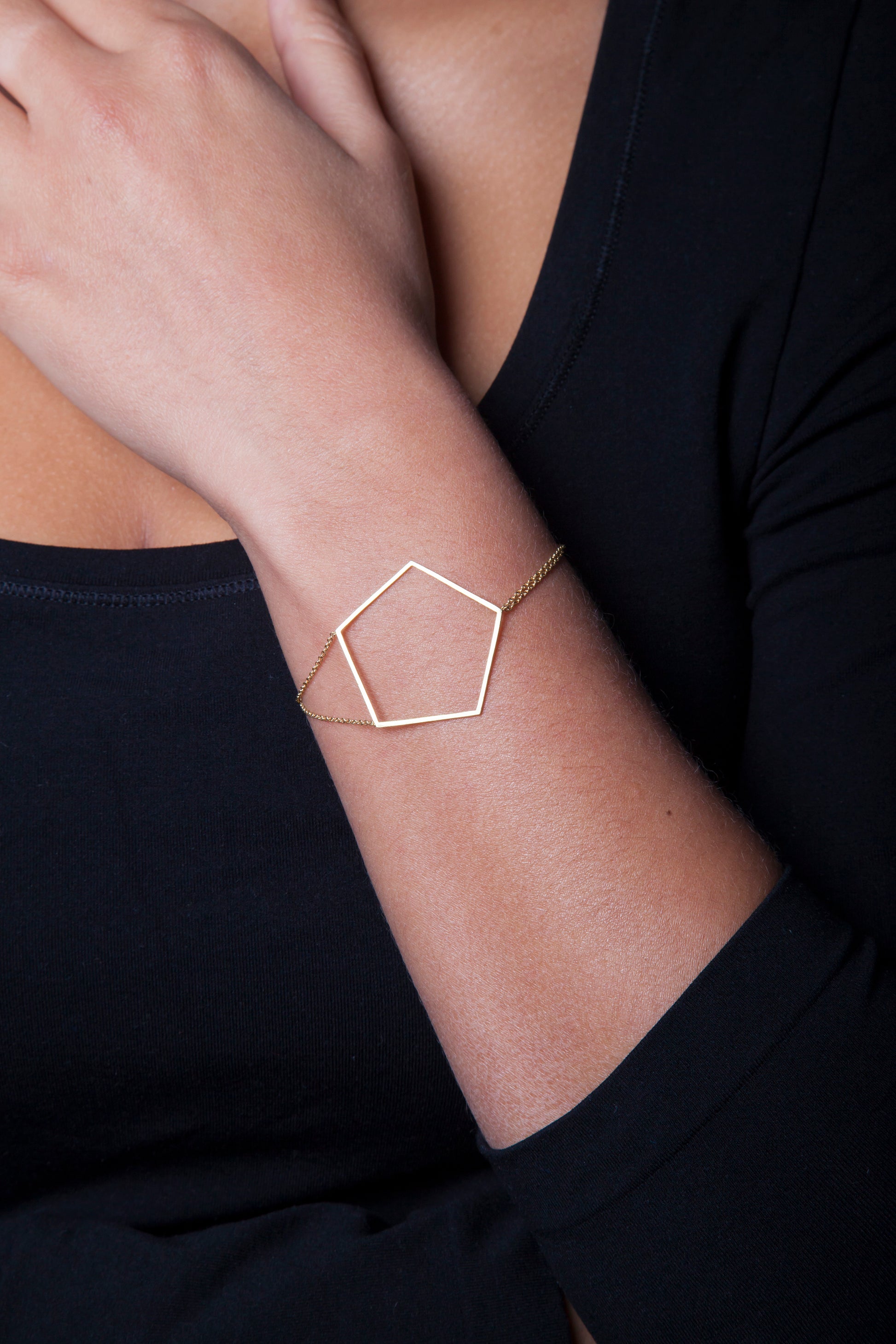 18k yellow gold pentagon bracelet on 18k yellow gold double cable chains.   Size: 7" in length; Pentagon: 1.5" wide Metal: 18k Yellow Gold Handmade by Meg C
