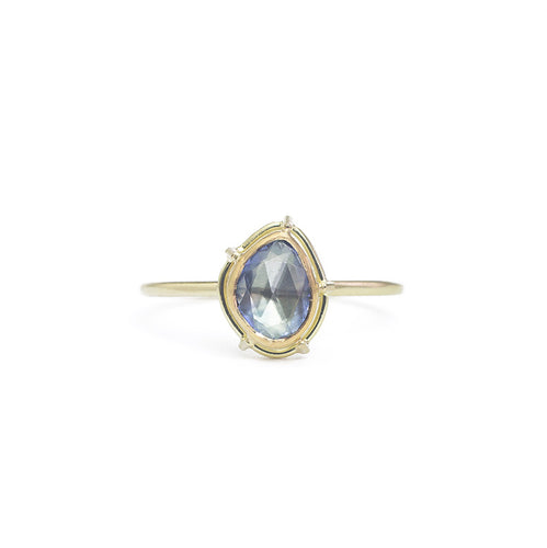 One-of-a-kind, pear shaped rose cut blue sapphire in a signature setting, on a shouldered lightweight band.   Size: 5.75 (can be resized) Stone: 0.64ct Rose Cut Sapphire  Metal: 18k Yellow Gold and 22k Yellow Gold Handmade by Tura Sugden 